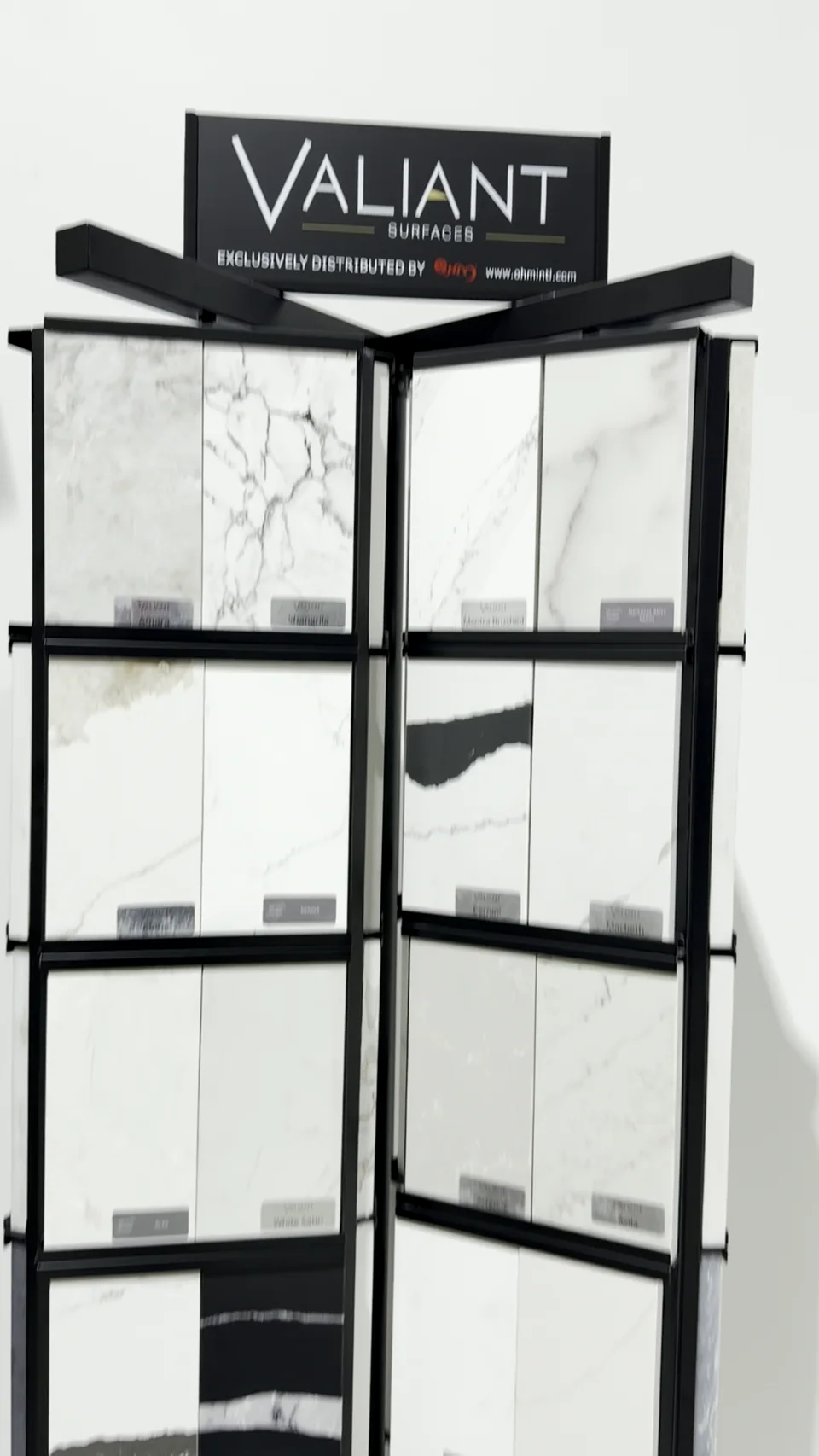 Manufacturer-branded countertop sample racks in the StoneGO showroom