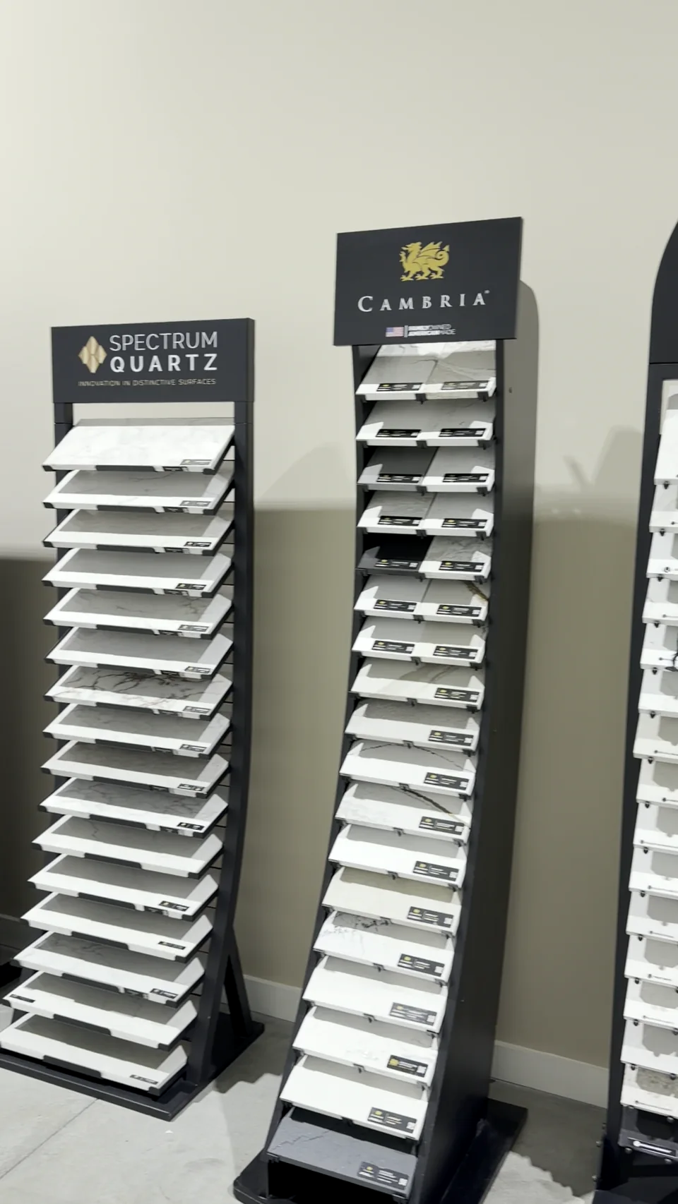 Countertop sample displays with visible manufacturer branding